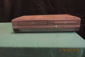 lot 43 image: MAGNAVOX DVDVCR PLAYER-MODEL MWD 2205 AND SUITCASE FULL OF VCR TAPES