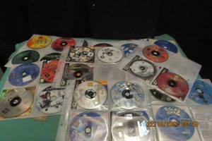 lot 48 image: PLAY STATION AND PLAYSTATION 2 GAMES AND OTHERS - 50 PLUS GAMES IN CD CARRIER
