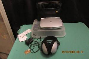 lot 49 image: DURABRAND PORTABLE DID PLAYER MODEL # DWR-7 AND SONY HEADPHONES MODEL# MDRCD250- COMES WITH- PLAYER, PWR ADAPTER, CASE I8NSTRUCTION AND REMOTE