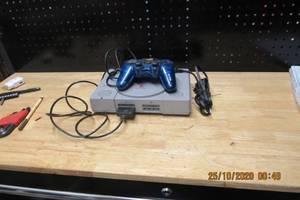 lot 143 image: PLAY STATION 1 WITH POWER CORD AND OFF MARKET CONTROLLER