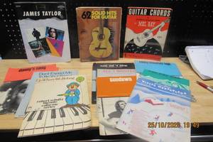 lot 58 image: GUITAR INSTRUCTIONAL BOOKS AND SONGS- 62 SOLID HITS FROM THE 60S AND 70S, GUITAR CHORDS BY MEL BAY, CLASSIC JAMES TAYLOR