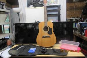 lot 32 image: FIRST ACT ACOUSTIC GUITAR- MG409, IBANEZ SOFT CASE, GUITAR STRINGS E,A,D,&G, FENDER GUITAR CABLE