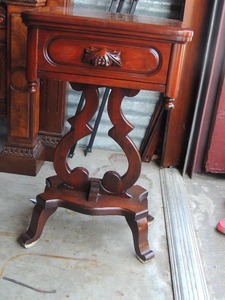 lot 14 image: American Black Walnut Wood side table - LYRICAL Design,  one drawer 28x17x14  DAVIS CABINET  COMP. NOTE   HAS WATER DAMAGE AT BASE