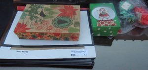 lot 31 image: Christmas boxes, ribbons, gift bags, and bows