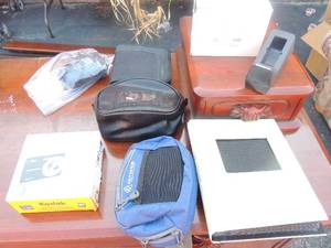 lot 33 image: Kodak digital camera black M320 comes with cord charger, fanny pack, CD holder and photo album