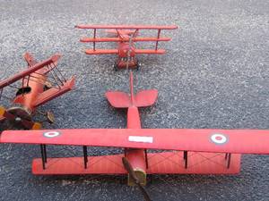 lot 39 image: RED WOOD PLANE -   #1  20 x 28W wings,  RED METAL  #10 plane 15x14x8  Biplane,    German plane by Metal Tri wing 14x15x8