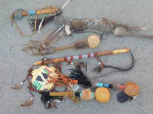 lot 42 image: NATIVE AMERICAN - SHAKER  RATTLE STICK  WLEATHER STRIPS, BEADS   RATTLE STICK W LEATHER TOMTOM, LEATHER STRIPS & BEADS  RIVER ROCK TOMAHAWK, SHAKER  RATTLE  W FEATHERS & BEADS  RATTLE W RABBIT FUR CLUB WBONE, FEATHERS & FUR - NAVAJO