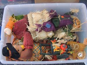 lot 46 image: Plastic tote of fall dcor- scarecrows, wagon, and more