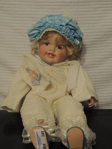 lot 249 image: Swan collection doll porcelain face eyes do not close blue baby hat blue shoes white outfit 25 tall