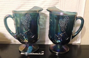 lot 101 image: 11 carnival glass pitchers grape design x 2