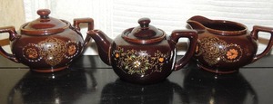 lot 102 image: Brown glass tea set-pot, creamer, sugar