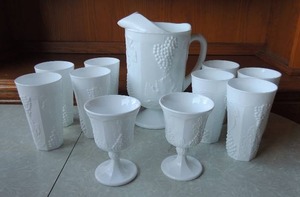 lot 180 image: Milk glass- 2 goblets, 8 tea glasses, 1 pitcher all grape design