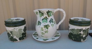 lot 103 image: 2 green leaf canisters with lids, 1 green leaf teapot on plate  hand painted  Made in Italy