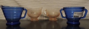 lot 140 image: Pink Depression Glass Creamer & Sugar   and  Vintage Cobalt Blue Glass Sugar & Creamer