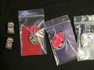 lot 359 image: Pierced earrings- guitar pic multi color, silver hoop, silver & gold rope, guitar pic pink with silver peace sign