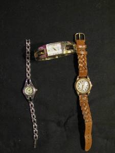 lot 334 image: Watches- ladies quartz silver band, gold cuff and rumors watch