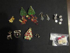 lot 344 image: Christmas jewlery-broaches(wreath, reindeer, tree marked KC) and pierced earrings (trees, snowflakes, bells etc.)
