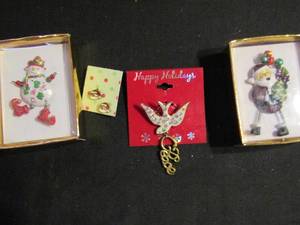 lot 331 image: Christmas jewlery- snowman pin, Santa pin, dove, Santa earrings