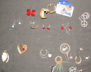 lot 338 image: several pairs of earrings, peace sign, heart shaped pin etc.