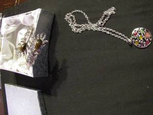 lot 390 image: Jeweled cuff bracelet palm frons with brown stone and multi color stones with silver pendant on chain