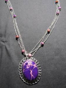 lot 388 image: Pendant with purple stone on 18 chain with bead