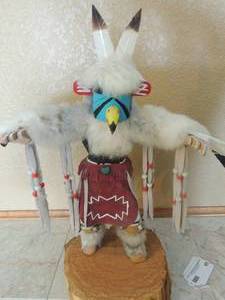 lot 43 image: Genuine Kachina doll -Eagle on wooden stand with wings 16x20agle Kachina doll
