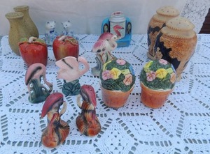 lot 104 image: S&P shakers- pairs of, steins, flamingos, flower pot, apple and cats on plate by Andrea of sader