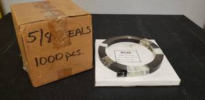 lot 57 image: STEEL STRAPPING RC68 34 X .02 X 200 FT, PLUS ADDITIONAL ROLE UNKNOWN LENGTH AND UNOPENED BOX OF 58 SEALS (1000 PCS)