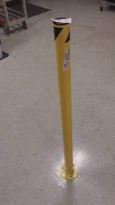 lot 91 image: SPRING LOADED STEEL PIPE BOLLARD, SAFETY YELLOW, 42H, OUTSIDE DIAMETER 2 18, WEIGHS 13#s