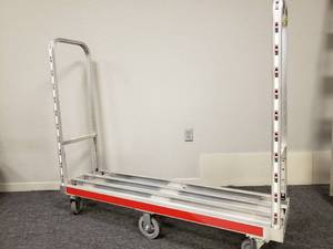 lot 141 image: ALUMINUM PLATFORM W2HANDLES, OA BED-60Lx16W, USABLE 55.5Wx16, 6X2 RIGID CNTR, 4-4x.25 END CASTERS, 1200# CAPACITY
