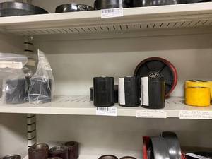 lot 429 image: Assorted Pallet Jack Wheel Lot, Black, Red and Yellow Colors