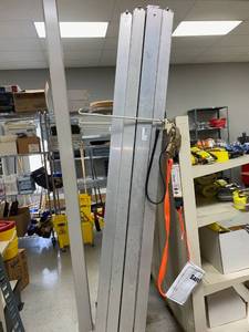 lot 548 image: 4 ft. E Track Rail (1 total) and Square E-Track Adjustable Load Lock (2 Total)