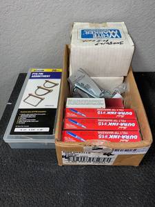 lot 576 image: PTO Pin Assortment, 3 Boxes of Dura-ink Blue Pens, 1 Box of  Lumber Crayons, Additions Pins and Caps, 2 Boxes of Natural White Marker SoapStone