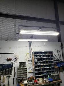 lot 885 image: metal Shop light mount with 2 Shop lights must bring tools to remove
