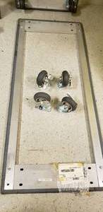 lot 132 image: DOLLY BASE 24x60 w 4 Locking SWIVEL CASTERS 6 12 (Needs Assembled)