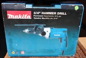 lot 11 image: Like New - Makita 2 speed 34 Inch Hammer Drill with Hard Case and Accessories - Model HP2050