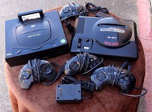 lot 38 image: SEGA GENESIS AND SEGA SATURN WITH ATTACHMENTS AS SHOWN