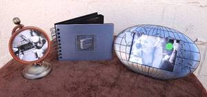 lot 51 image: ASSORTED METAL TRAVEL THEMED FRAMS AND PHOTO STORAGE BOOK