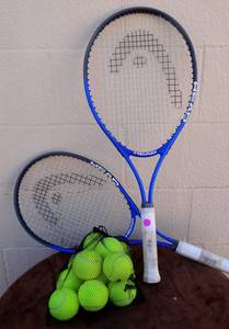 lot 146 image: PAIR OF HEAD TENNIS RACKETS AND LARGE BAG OF TENNIS BALLS