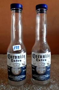 lot 173 image: CORONA EXTRA SALT AND PEPPER SHAKERS