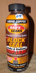 lot 214 image: Bars Leaks 1109 Block Seal Liquid Copper Intake and Radiator Stop Leak - 18 oz. (RETAIL $18.99)