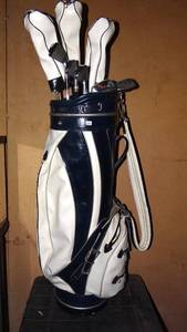 lot 276 image: SET OF SAM SNEAD GOLD CLUBS, WOODS AND CUSTOM LEATHER BAG