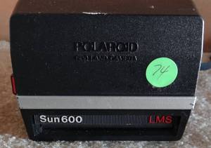 lot 74 image: Vintage Polaroid Sun 600 Instant Camera wLight Management System, Flash & Strap