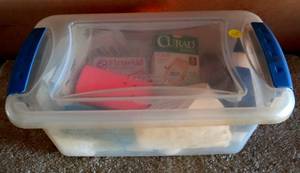 lot 115 image: FIRST AID SUPPLIES IN LARGE PLASTIC STORAGE CONTAINER
