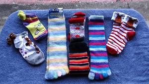 lot 348 image: LOT OF ASSORTED TOE SOCKS AND FUN SLIP ON SOCKS