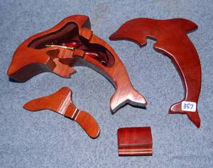 lot 357 image: COOL WOODEN DOLPHIN CUTAWAY WITH SECRET STORAGE HOLDING TWO SMALL BABIES
