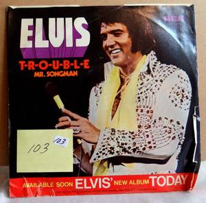 lot 103 image: VINTAGE ELVIS PRESLEY 45RPM RECORD WITH ORIGINAL SLEEVE TROUBLEMR SONGMAN - $$$