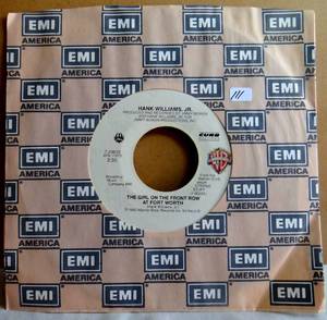 lot 111 image: Hank Williams, Jr.-Leave Them Boys Alone  The Girl On The Front-45rpm-1983