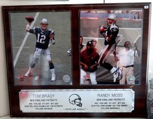 lot 194 image: AMAZING 16 X 20 WOOD PLAQUE FEATURING TOM BRADY AND RANDY MOSS - 8 X 10 PHOTOS AND ENGRAVED STAT PLATES