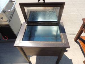 lot 2 image: OUTDOOR  table ICE CHEST - METAL LINED   Horse shoe handles 30x27x19  HAS BOTTLE OPER ATTACHED  FOR ALL YOUR PARTY NEEDS